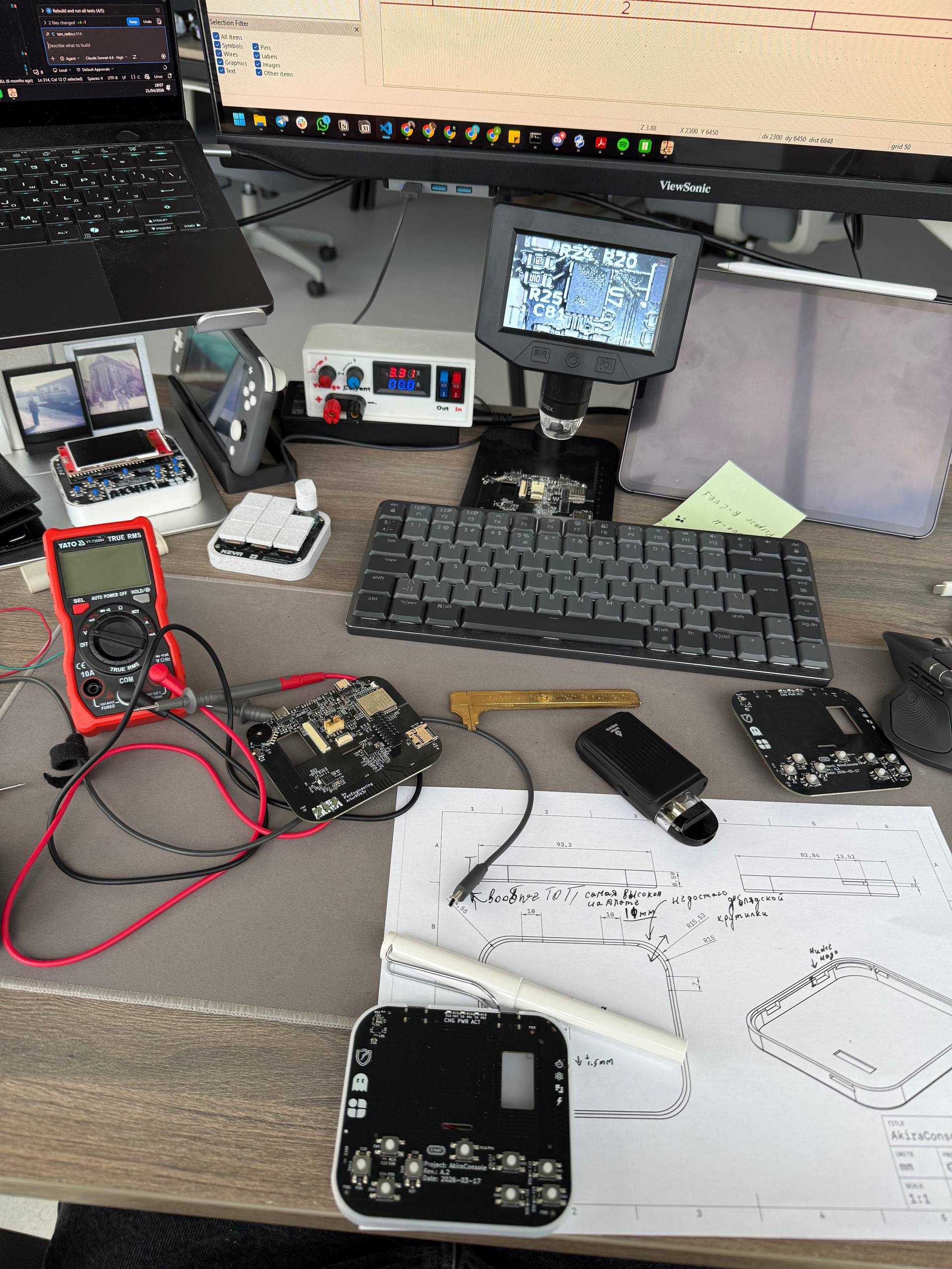 Development bench — AkiraConsole PCB assembly and testing
